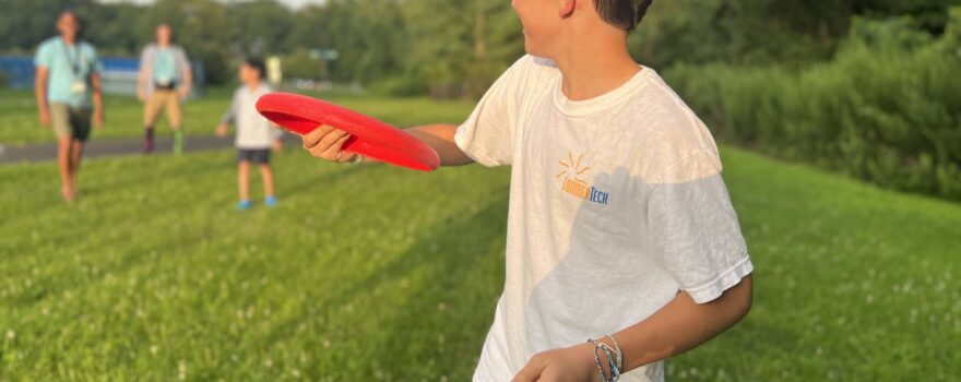 12-year-old throwing frisbee